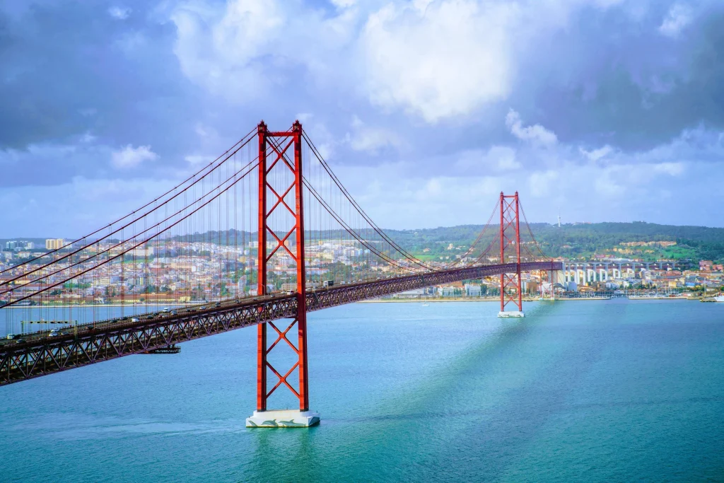 beautiful scenery 25 de abril bridge portugal breathtaking cloud formations