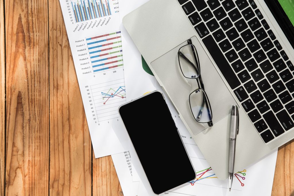 flat lay business chart on wood background