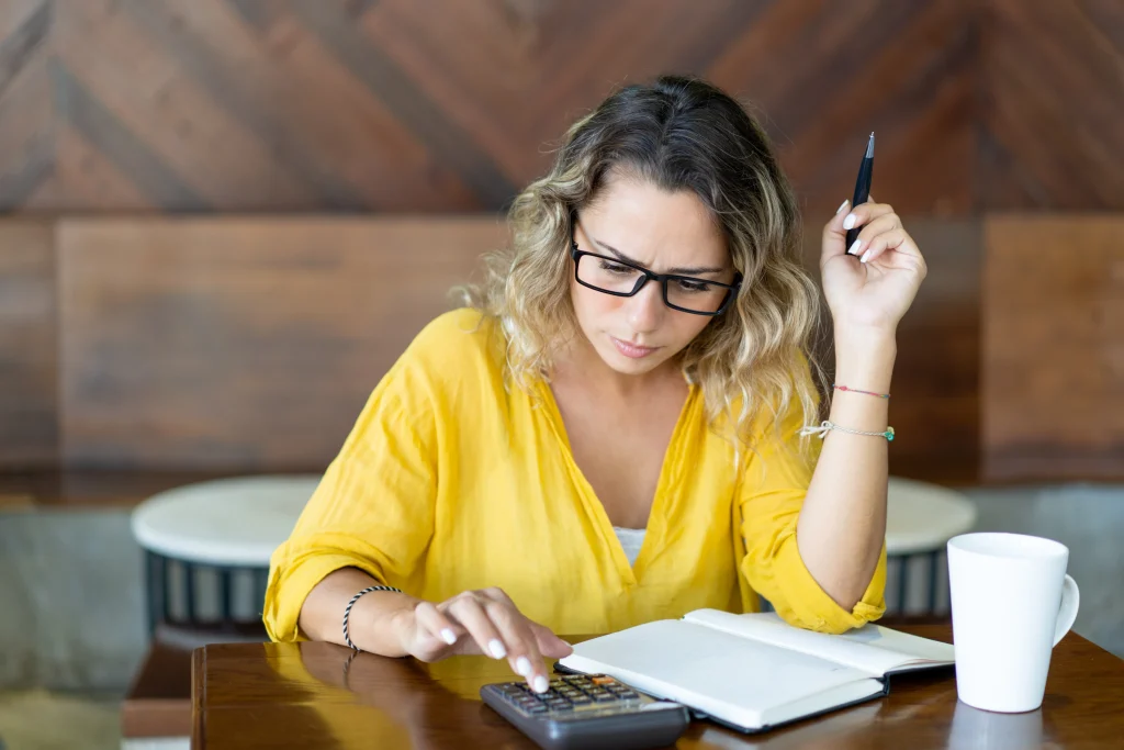 pretty frowning girl counting budget
